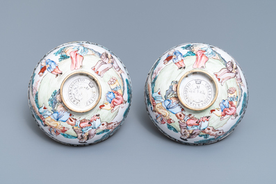 A pair of Chinese Canton enamel bowls with figures in a landscape, Yongzheng/Qianlong