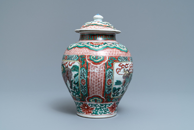 A Chinese wucai &lsquo;mythical beasts&rsquo; vase and cover, Transitional period