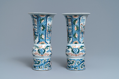 A pair of polychrome Dutch Delft chinoiserie beaker vases, 18th C.