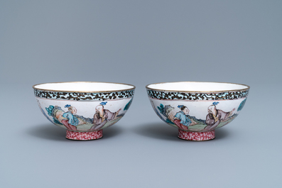 A pair of Chinese Canton enamel bowls with figures in a landscape, Yongzheng/Qianlong