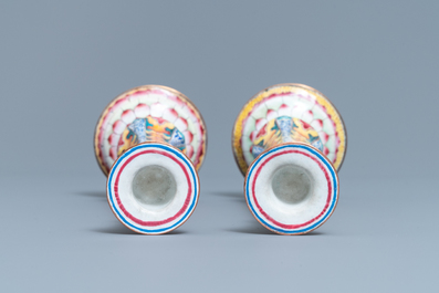 A pair of Chinese Canton enamel candlesticks with floral design, Yongzheng