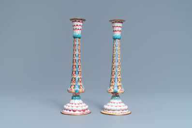 A pair of Chinese Canton enamel candlesticks with floral design, Yongzheng