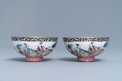 A pair of Chinese Canton enamel bowls with figures in a landscape, Yongzheng/Qianlong