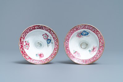 A pair of Chinese Canton enamel candlesticks with floral design, Yongzheng