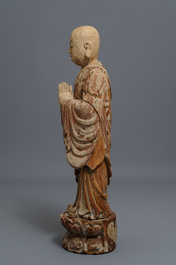 A Chinese painted wood figure of a Buddhist monk, 19th C.