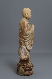 A Chinese painted wood figure of a Buddhist monk, 19th C.