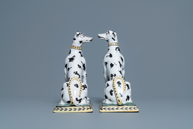 A pair of polychrome Brussels faience models of spotted greyhound dogs, 18th C.