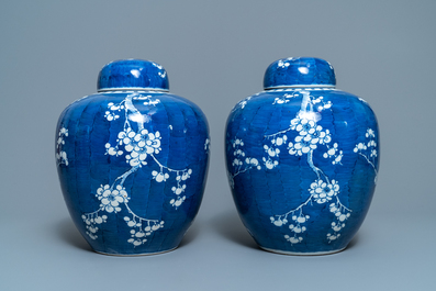 A pair of Chinese blue and white 'prunus on cracked ice' jars and covers, 19th C.