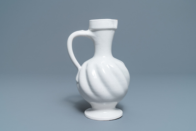 A white Dutch Delft gadrooned jug, 17th C.
