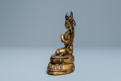 Une figure de Bouddha en bronze dor&eacute; incrust&eacute;, Sino-Tibet, Ming
