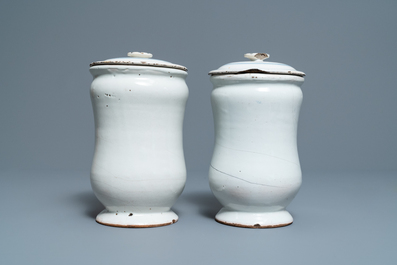 A pair of blue and white French faience albarello-type drug jars and covers, 2nd half 18th C.