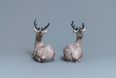 A pair of large Chinese aubergine-glazed models of recumbent deer, 18/19th C.