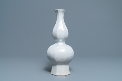 An octagonal white Delftware bottle vase, Dutch or French, 18th C.