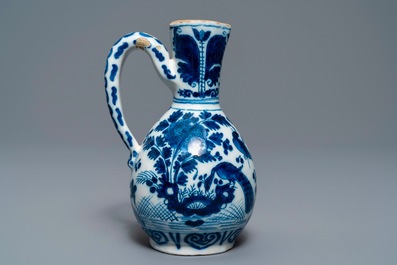 Three Dutch Delft blue and white vases and a chinoiserie jug, 17/18th C.