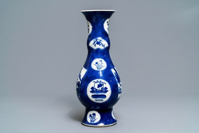 A Chinese powder blue-ground vase with landscape medallions, Kangxi