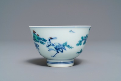 A Chinese doucai bowl with figures in a landscape, Kangxi mark, 19/20th C.