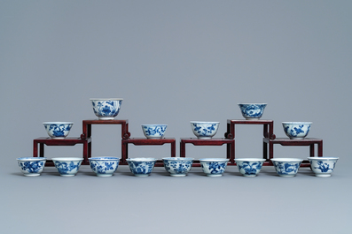 A collection of 22 Chinese blue and white cups and 32 saucers, Kangxi/Qianlong