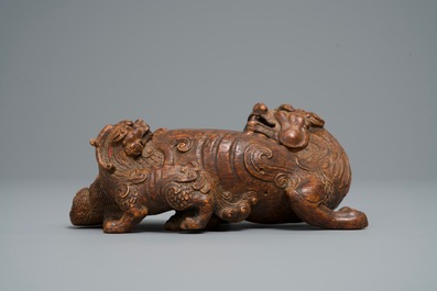 A Chinese carved wood 'Qilin and cub' group, 19/20th C.