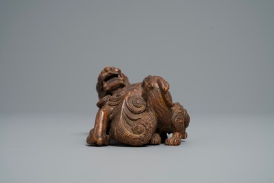 A Chinese carved wood 'Qilin and cub' group, 19/20th C.