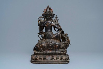 A large Chinese bronze group of Guanyin on a dragon, prob. Ming