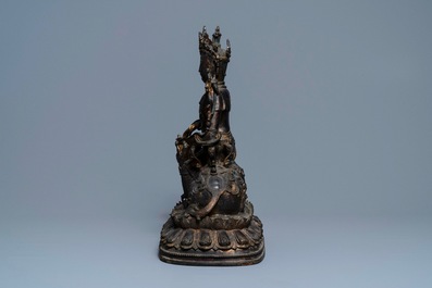 A large Chinese bronze group of Guanyin on a dragon, prob. Ming