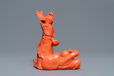 A Chinese carved coral group with a laughing Buddha, Republic, 20th C.