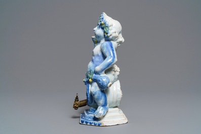 Une fontaine de table figurant Bacchus sur un tonneau en fa&iuml;ence polychrome de Bruxelles, 18&egrave;me