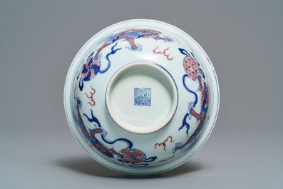 A Chinese blue, white and underglaze red 'Buddhist lion' bowl, Qianlong mark and of the period