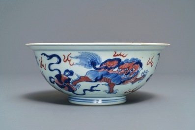 A Chinese blue, white and underglaze red 'Buddhist lion' bowl, Qianlong mark and of the period