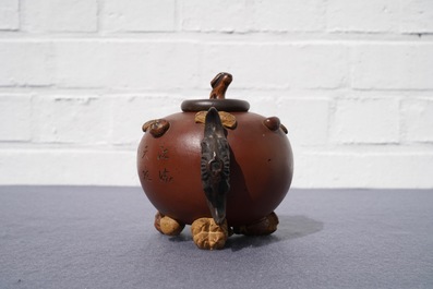 A Chinese Yixing stoneware relief-decorated teapot with nuts and fruits, Shao Er Quan mark, Daoguang