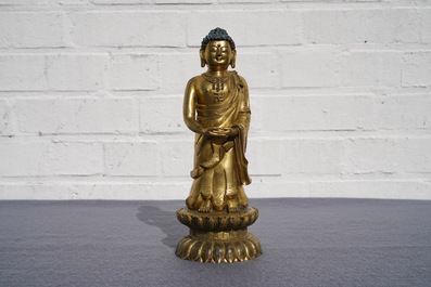 An inscribed Chinese gilt bronze figure of Buddha standing, Qianlong