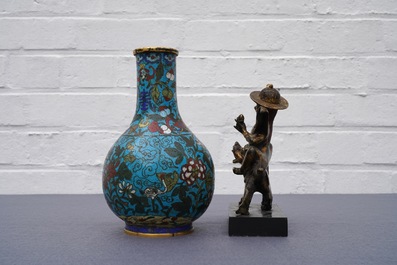 A Chinese cloisonn&eacute; bottle vase and a gilt bronze group, 18/19th C.