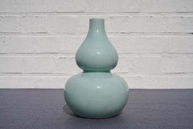 A Chinese monochrome celadon double gourd vase, Qianlong mark, 19th C.