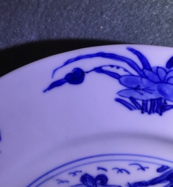 Four Chinese blue and white 'fish in a pond' plates, Kangxi mark and of the period