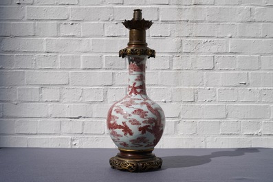 A Chinese underglaze red bottle-shaped 'dragon' vase with gilt-bronze mounts, 18/19th C.