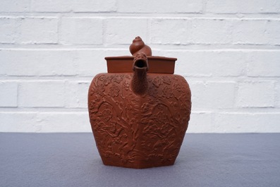 A large Chinese Yixing stoneware teapot with applied design, Kangxi