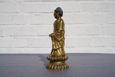 An inscribed Chinese gilt bronze figure of Buddha standing, Qianlong