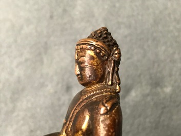 A Sino-Tibetan gilt bronze figure of Buddha, 16/17th C.