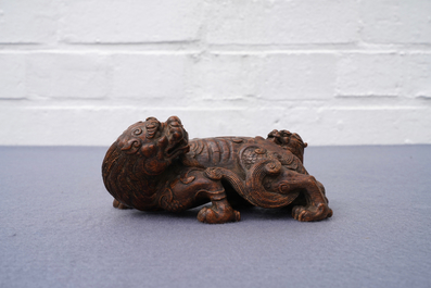 A Chinese carved wood 'Qilin and cub' group, 19/20th C.