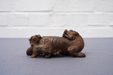 A Chinese carved wood 'Qilin and cub' group, 19/20th C.