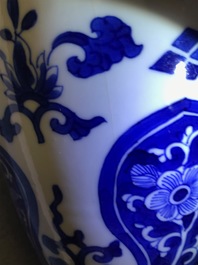 A pair of Chinese olive-shaped blue and white covered jars, Kangxi