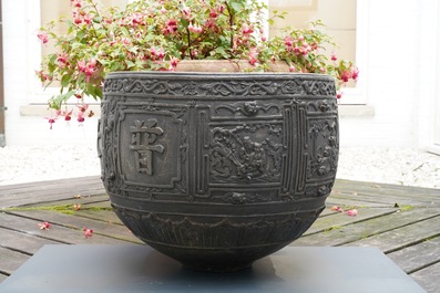 A large Chinese bronze relief-decorated jardini&egrave;re, Xuande mark, 18/19th C.