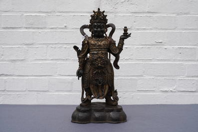 A Chinese gilt-lacquered bronze figure of Weituo, Ming