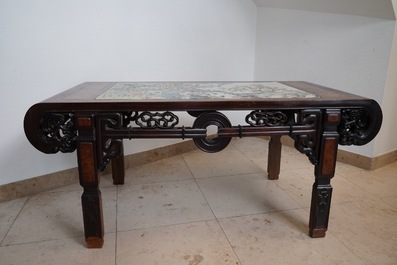 A large Chinese famille rose plaque inset in a wooden table, Republic, 20th C.