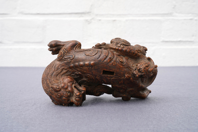 A Chinese carved wood 'Qilin and cub' group, 19/20th C.