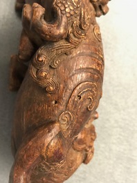 A Chinese carved wood 'Qilin and cub' group, 19/20th C.