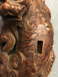 A Chinese carved wood 'Qilin and cub' group, 19/20th C.