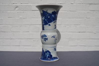 A Chinese blue and white 'gu' vase with landscape design, Kangxi mark and of the period