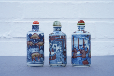 Three Chinese blue, white and underglaze red snuff bottles, Yongzheng marks, 19th C.