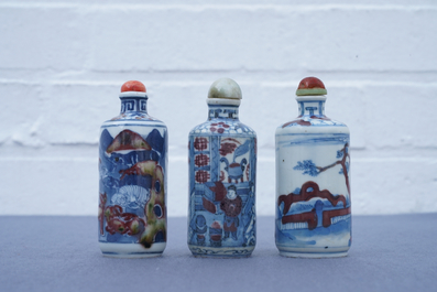 Three Chinese blue, white and underglaze red snuff bottles, Yongzheng marks, 19th C.